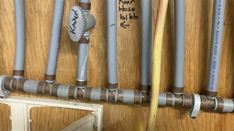 Example of poly b pipe in a home under a sink